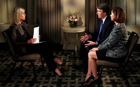 Brett Kavanaugh and his wife Ashley Estes Kavanaugh during a FOX News interview with Martha MacCallum - Credit:  Jacquelyn Martin/AP