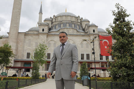 Mustafa El Sagezli, General Manager of Libyan Programme for Reintegration and Development (LPRD), poses in front of the Fatih Mosque in Istanbul, Turkey May 11, 2018. Picture taken May 11, 2018. REUTERS/Huseyin Aldemir
