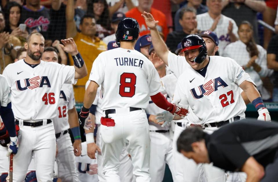 USA infielder Trea Turner (8) celebrates with teammates after a fly ball homer to left field in the second inning during the World Baseball Classic semifinal at loanDepot Park in Miami, Fla. on Sunday, March 19, 2023.
