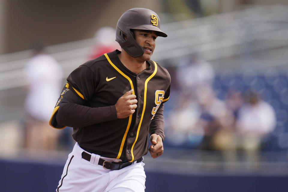 San Diego Padres' Trent Grisham runs the bases after hitting a home run in a spring training baseball game against the Kansas City Royals, Sunday, March 7, 2021, in Peoria, Ariz. (AP Photo/Sue Ogrocki)