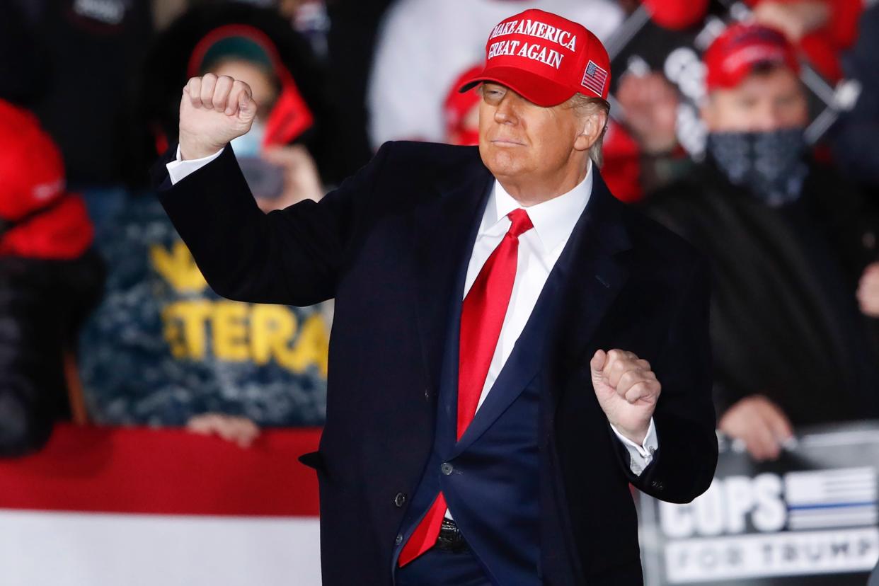 Donald Trump dances on stage after speaking during a campaign rally in Janesville, Wisconsin on Saturday (EPA)