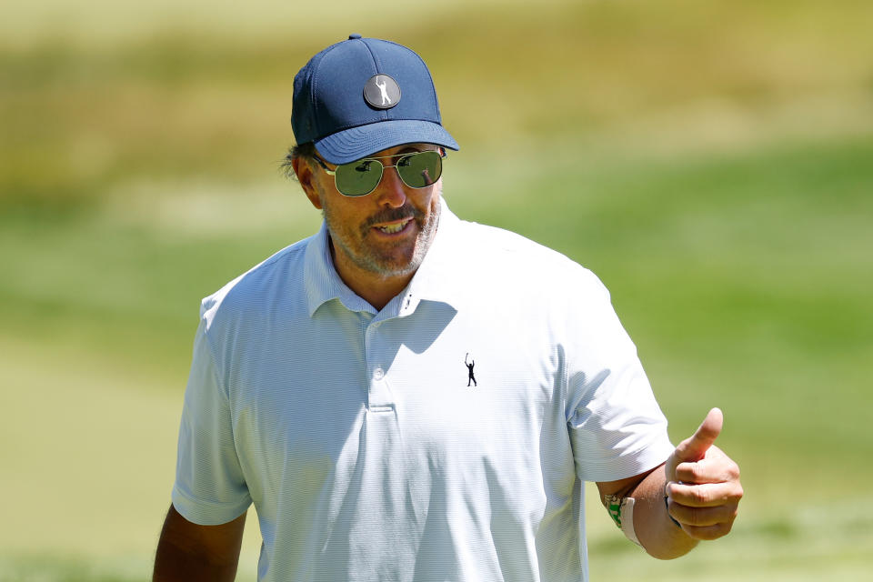 Pictured here, Phil Mickelson giving a thumbs up during a practice round before the US Open. 