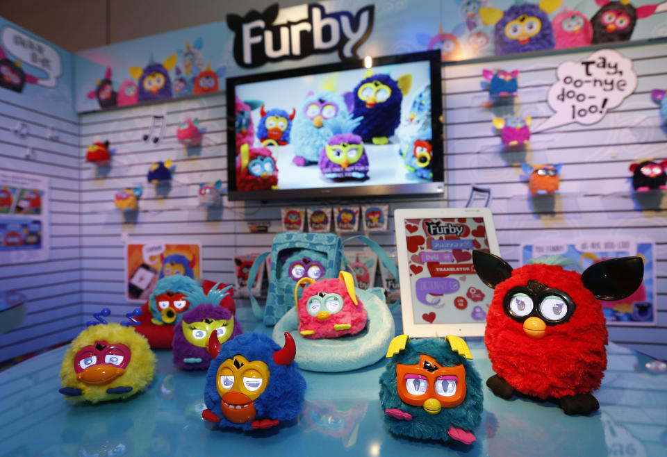 IMADE DISTRIBUTED FOR HASBRO - FURBY PARTY ROCKERS creatures rock out in Hasbro’s showroom at the American International Toy Fair, Sunday, Feb. 10, 2013, in New York. Available this month, each of these funky friends has its own personality, and make a lively companion for the FURBY toy. (Photo by Jason DeCrow/Invision for Hasbro/AP Images)