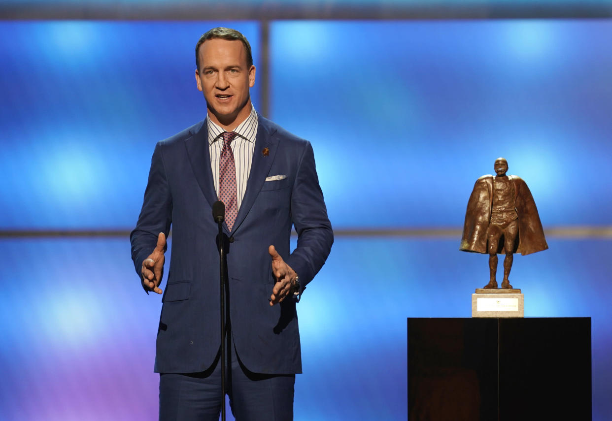 Peyton Manning, shown presenting the Walter Payton NFL Man of the Year award in February, won't be joining "Monday Night Football," according to a report. (AP)