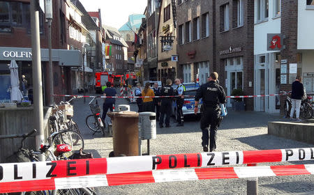 Police block a street near a place where a man drove a van into a group of people sitting outside a popular restaurant in the old city centre of Muenster, Germany, April 7 2018. REUTERS/Elke Ahlswede