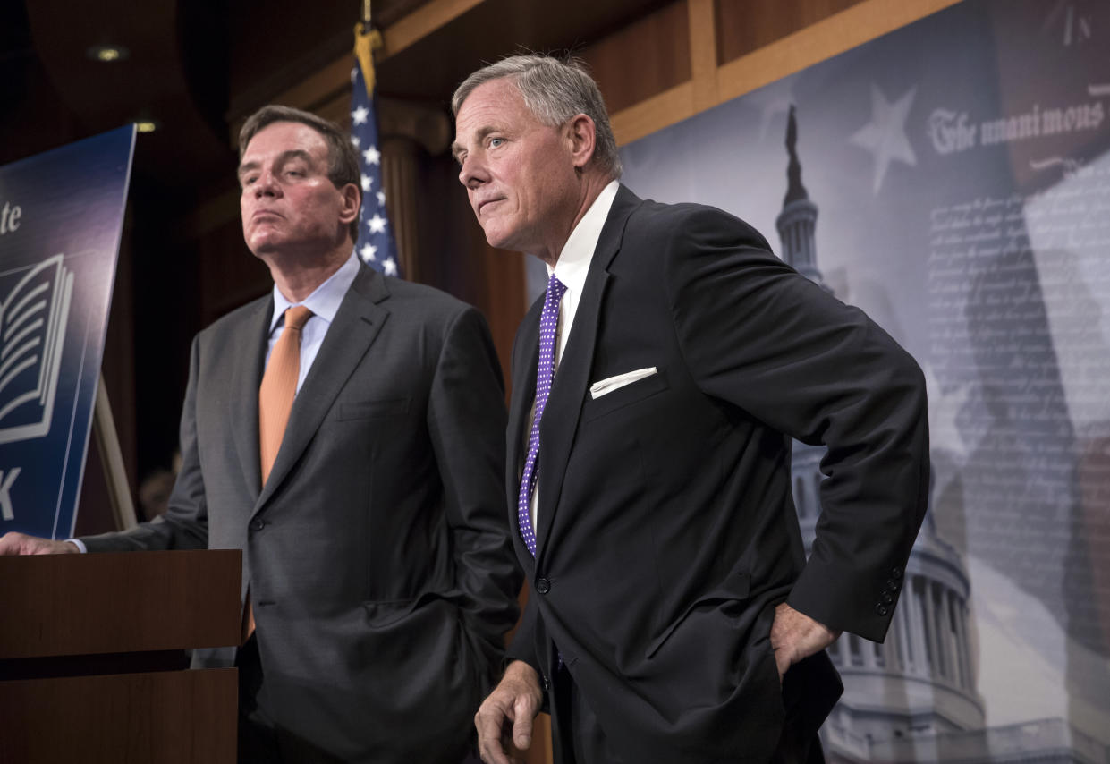 Senate Select Committee on Intelligence Chairman Richard Burr, R-N.C., and Vice Chairman Mark Warner, D-Va., left, update reporters on the status of their inquiry into Russian interference in the 2016 U.S. election, at the Capitol Oct. 4. Burr says the committee has interviewed more than 100 witnesses as part of its investigation and that more work still needs to be done. (Photo: J. Scott Applewhite/AP)