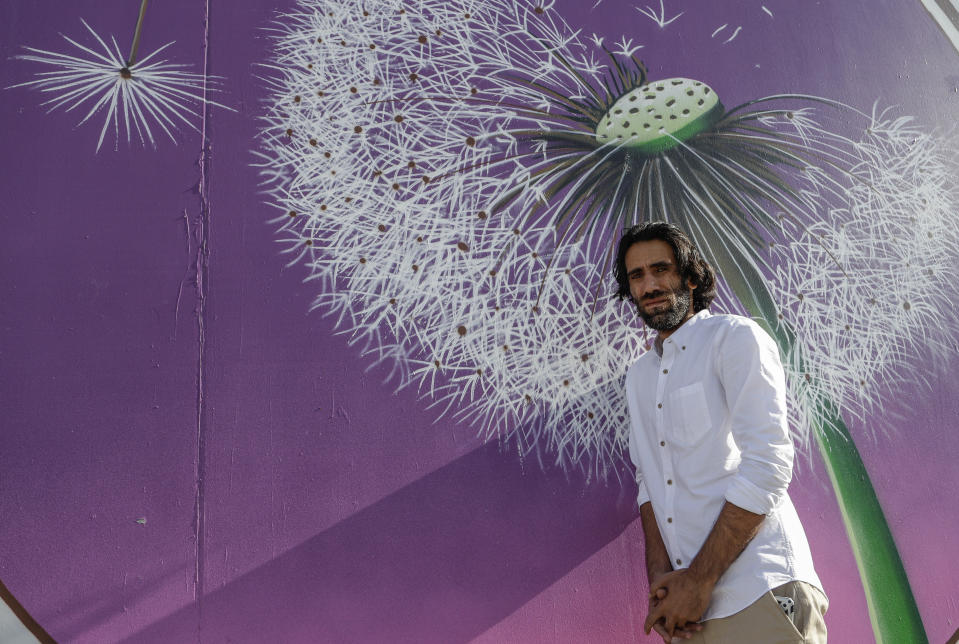 In this Nov. 19, 2019, photo, Behrouz Boochani, the Kurdish film-maker, writer and refugee who has documented life inside the Australian offshore immigration camp on Manus Island, poses for a portrait in Christchurch, New Zealand. (AP Photo/Mark Baker)