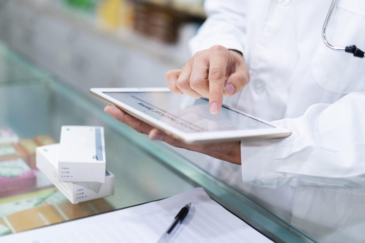 Pharmacist with digital tablet for Online Pharmacy