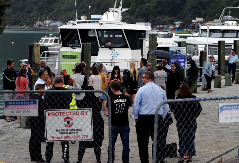 Relatives wait for rescue mission, following the White Island volcano eruption in Whakatane