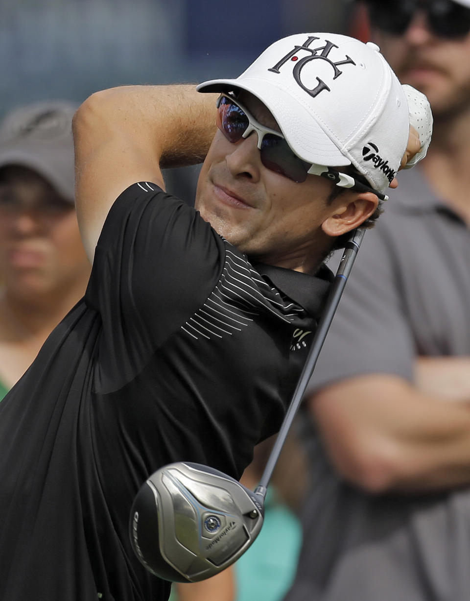 Scott Langley hits his tee shot on the 14th hole during the final round of the Valspar Championship golf tournament at Innisbrook, Sunday, March 16, 2014, in Palm Harbor, Fla. Langley finished third. (AP Photo/Chris O'Meara)