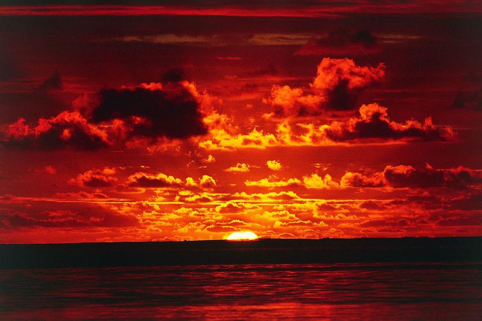 <p>A sunset lights the sky on fire over the lagoon in Bora Bora // February 09, 2016</p>