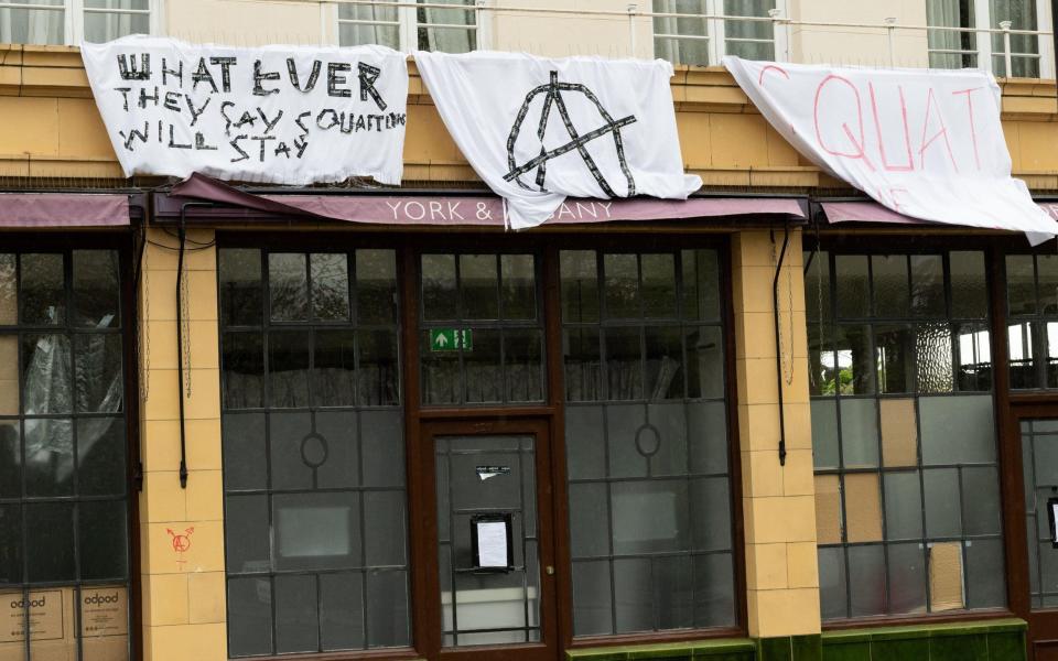 The former York & Albany pub is now decorated with banners hung by squatters who recently occupied the building