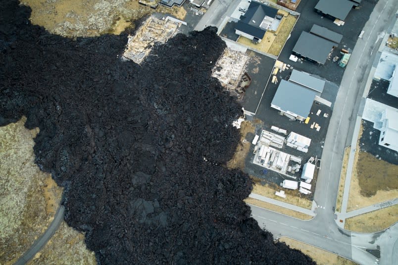 REYKJANES, ICELAND – JANUARY 15: An aerial view of the fissure, which had stopped erupting but claimed three houses in the town of Grindavik in Reykjanes Peninsula, Iceland on January 15, 2024. (Photo by Stringer/Anadolu via Getty Images)