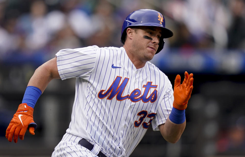 FILE - New York Mets' James McCann runs after hitting a double off Atlanta Braves starting pitcher Ian Anderson during the fifth inning of a baseball game May 4, 2022, in New York. The Baltimore Orioles acquired catcher McCann and cash from the Mets on Wednesday night, Dec. 21, for a player to be named. (AP Photo/John Minchillo, File)