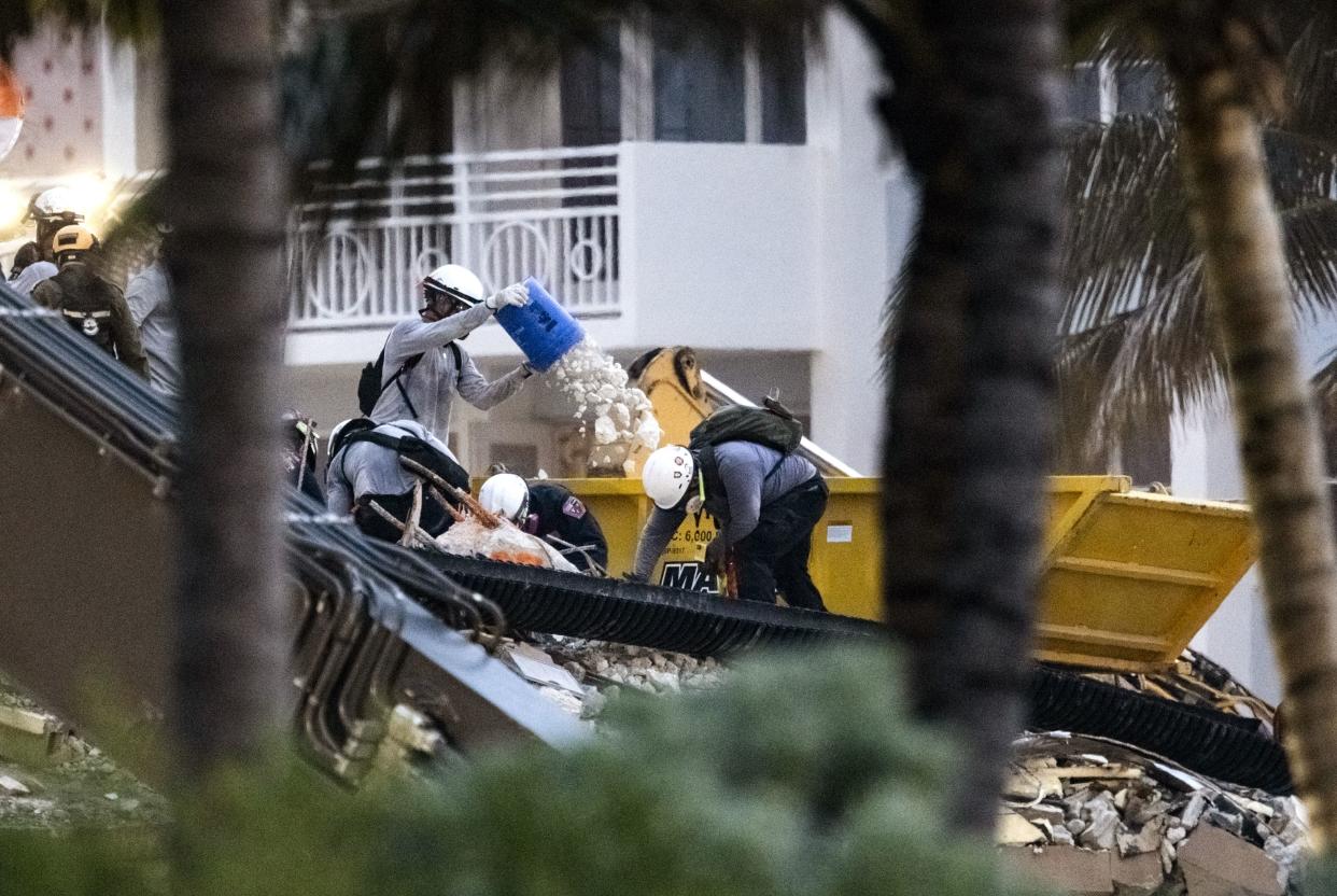 Search and rescue personnel search for survivors through the rubble at the Champlain Towers South Condo in Surfside, Fla. on Wednesday, June 30, 2021.