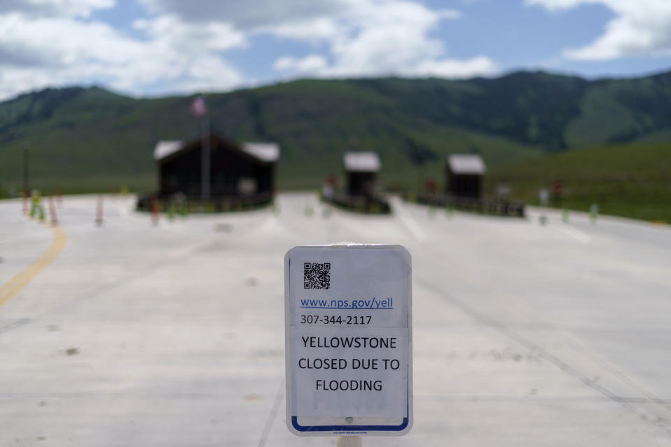 FILE - An entrance to Yellowstone National Park, a major tourist attraction, sits closed due to the historic floodwaters on June 15, 2022, in Gardiner, Mont. As cleanup from historic floods at Yellowstone National Park grinds on, climate experts and meteorologists say the gap between the destruction in the area and what was forecast underscores a troublesome trend tied to climate change: Modeling programs used to predict storms aren't keeping up with increasingly extreme weather. (AP Photo/David Goldman, File)