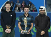 Tennis - ATP - Qatar Open - Khalifa International Tennis and Squash Complex, Doha, Qatar - January 5, 2019 Spain's Roberto Bautista Agut and Czech Republic's Tomas Berdych celebrate with their trophies after Roberto Bautista Agut wins the final REUTERS/Ibraheem Al Omari