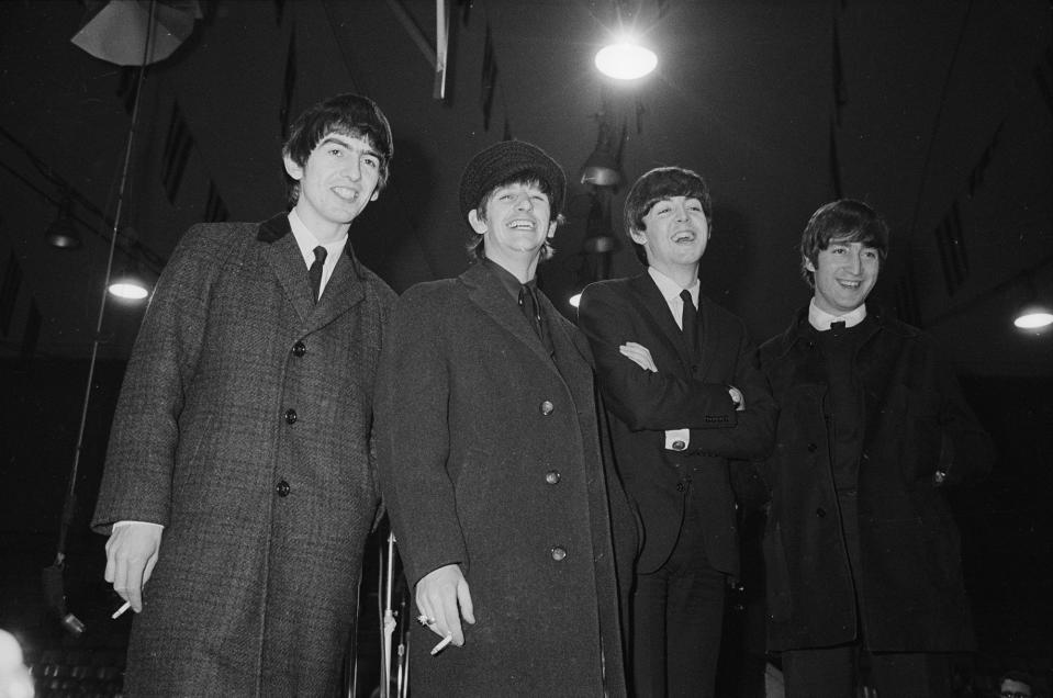 The Beatles heading to a press conference in Washington, DC in 1964