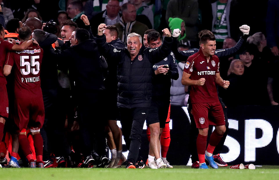 Cluj manager Dan Petrescu celebrates victory after the final whistle during the UEFA Champions League third qualifying round second leg match at Celtic Park, Glasgow. (Photo by Jane Barlow/PA Images via Getty Images)