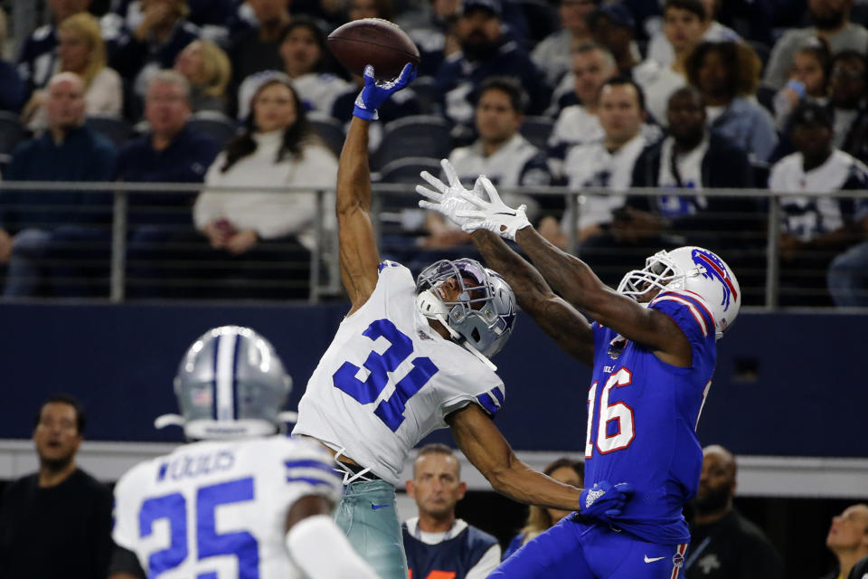 FILE - In this Nov. 28, 2019, file photo, Dallas Cowboys cornerback Byron Jones (31) breaks up a pass intended for Buffalo Bills wide receiver Robert Foster (16) in the first half of an NFL football game in Arlington, Texas. After months of hoarding resources for rebuilding, the Miami Dolphins finally started spending Monday, March 16, 2020, when they sealed deals with four likely starters in the early hours of free agent negotiations. Miami made Jones the NFL's highest-paid cornerback, surpassing his new teammate, Xavien Howard. (AP Photo/Michael Ainsworth, File)