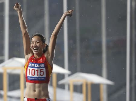 China's Wei Yongli reacts after finishing the women's 100m final at the Incheon Asiad Main Stadium during the 17th Asian Games September 28, 2014. REUTERS/Kim Kyung-Hoon