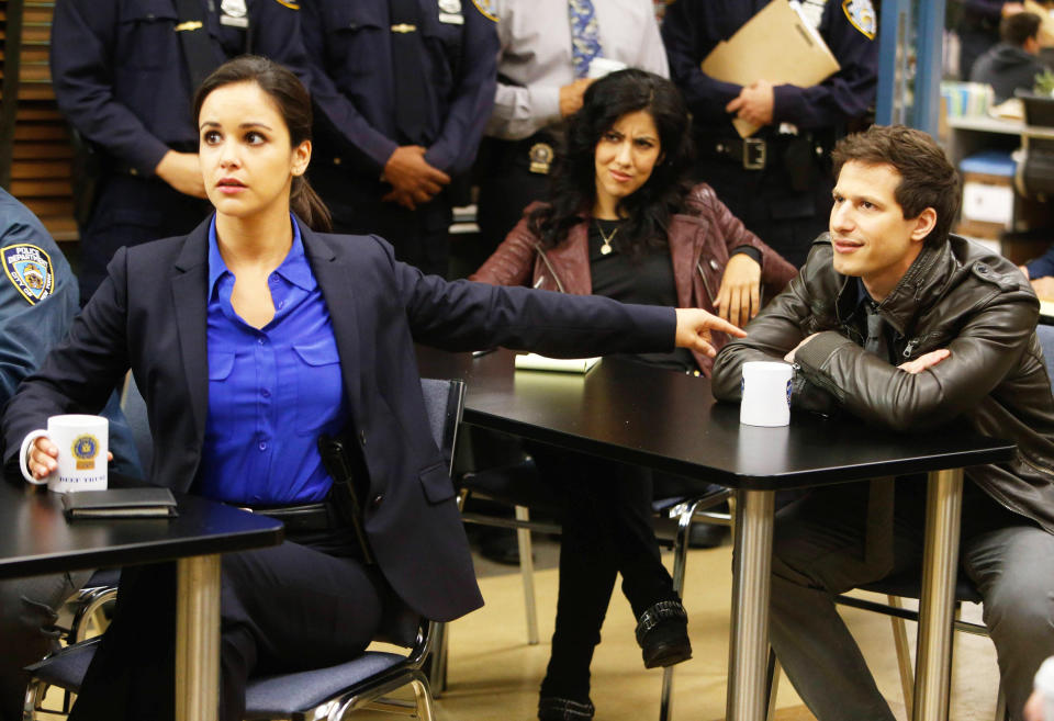 Amy Santiago, looking frightened, points at Jake