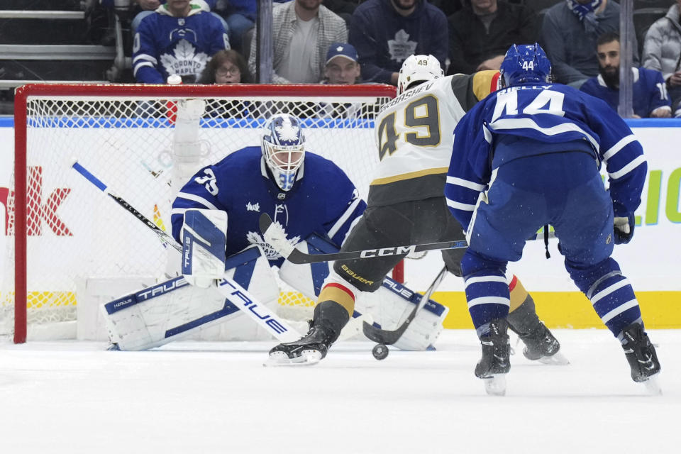 Vegas Golden Knights' Ivan Barbashev (49) scores against Toronto Maple Leafs goaltender Ilya Samsonov, left, during the second period of an NHL hockey game in Toronto, on Tuesday, Feb. 27, 2024. (Chris Young/The Canadian Press via AP)