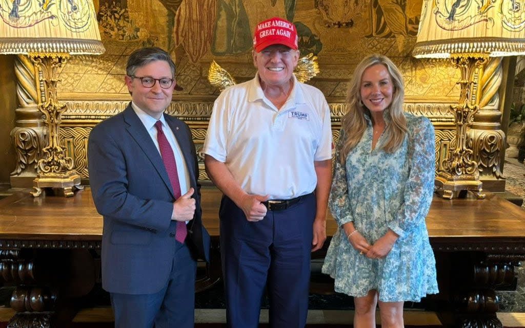 Mike Johnson, house speaker, his wife, Kelly, and Donald Trump at Mar-a-Lago on Sunday