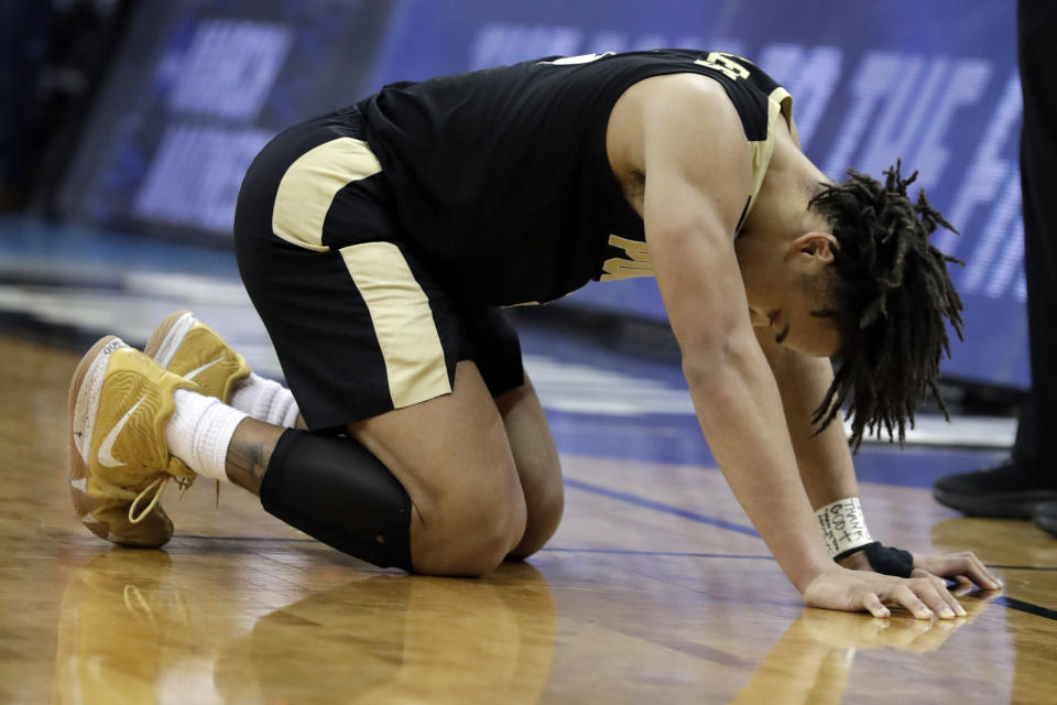 Purdue's Carsen Edwards reacts after a Purdue turnover during overtime of the men's NCAA Tournament college basketball South Regional final game against Virginia, Saturday, March 30, 2019, in Louisville, Ky. Virginia won 80-75. (AP Photo/Michael Conroy)