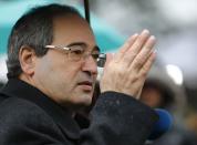 Syrian Deputy Foreign Minister Faisal Meqdad addresses the media after a meeting at the Geneva Conference on Syria at the United Nations European headquarters in Geneva February 10, 2014. (REUTERS/Denis Balibouse)