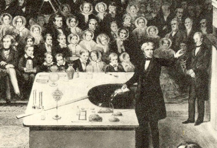 <span class="caption">Michael Faraday was a celebrated theorist of electromagnetism – and even dabbled in the paranormal.</span> <span class="attribution"><a class="link " href="https://commons.wikimedia.org/wiki/Michael_Faraday#/media/File:Faraday_xmas_detail.jpg" rel="nofollow noopener" target="_blank" data-ylk="slk:Alexander Blaikley/London Illustrated News;elm:context_link;itc:0;sec:content-canvas">Alexander Blaikley/London Illustrated News</a></span>