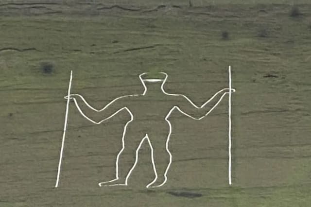 Vandals add face mask to centuries-old figure carved into hill