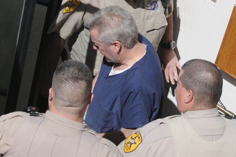 Former Bollingbrook, Ill., police Sgt. Drew Peterson leaves Will County circuit court after his arraignment on May 18, 2009, in Joliet, Ill. On February 21, 2013, Peterson, 59, was sentenced to 38 years in prison for the 2004 murder of his third wife, Kathleen Savio. File Photo by David Banks/UPI