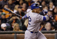 Los Angeles Dodgers' Justin Turner drives in a run with a single against the San Francisco Giants during the seventh inning of a baseball game against the San Francisco Giants on Tuesday, April 15, 2014, in San Francisco. (AP Photo/Marcio Jose Sanchez)