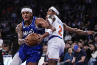 Orlando Magic's Paolo Banchero, left, drives past New York Knicks' Miles McBride (2) during the first half of an NBA basketball game Monday, Jan. 15, 2024, in New York. (AP Photo/Frank Franklin II)