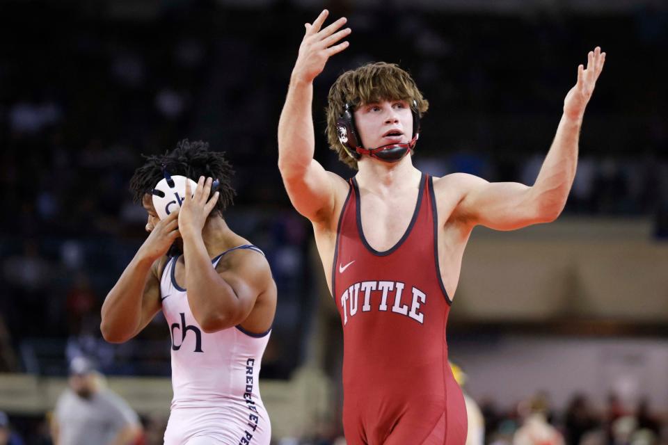 Tuttle's Beau Hickman celebrates after beating Tulsa Cascia Hall's Treshuan Tecson in the Class 4A 144-pound championship match at the state tournament Saturday night at State Fair Arena.