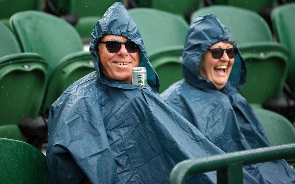 The wet weather didn’t seem so bad with rain ponchos and a little refreshment - Justin Setterfield/Getty Images