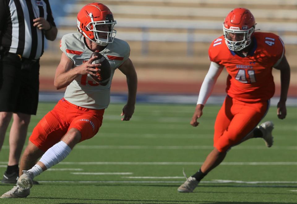 Quarterback Ben Imler is flushed out of the pocket by Elijiah Dunson during San Angelo Central High School's spring football game at San Angelo Stadium on Wednesday, May 18, 2022.