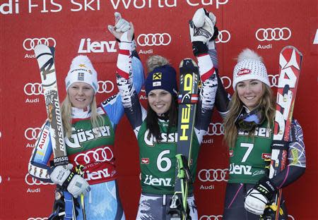 Sweden's Jessica Lindell-Vikarby, Austria's Anna Fenninger and Mikaela Shiffrin of the U.S. (LtoR) stand on the podium after the women's giant slalom World Cup race in the Tyrolean ski resort of Lienz December 28, 2013. REUTERS/Leonhard Foeger