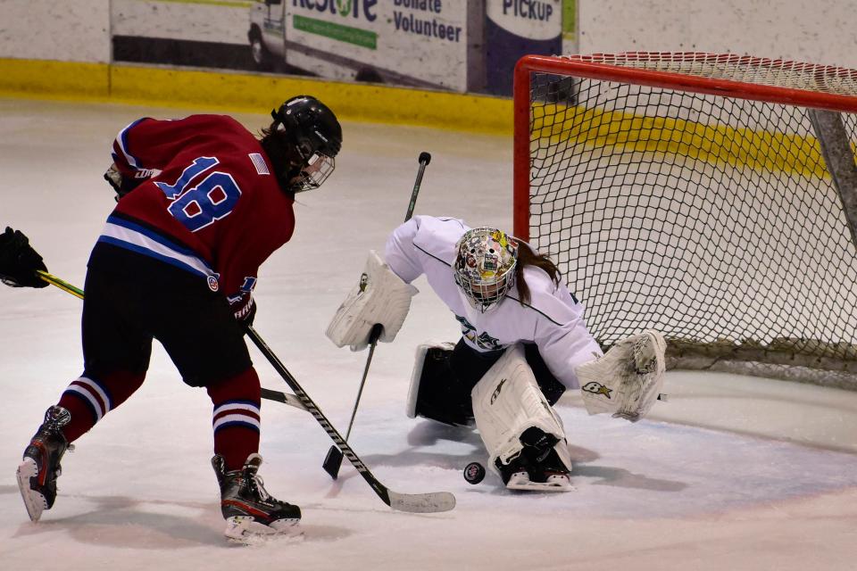 Montville goaltender Alexis Riley, #32, makes a save shot by Eric Nemeth of Newton/Lenape Valley during the third period of their ice hockey game at Mennen Arena in Morristown Monday January 3rd, 2022.