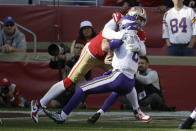 Minnesota Vikings quarterback Kirk Cousins, right, is sacked by San Francisco 49ers defensive end Arik Armstead during the first half of an NFL divisional playoff football game, Saturday, Jan. 11, 2020, in Santa Clara, Calif. (AP Photo/Marcio Jose Sanchez)