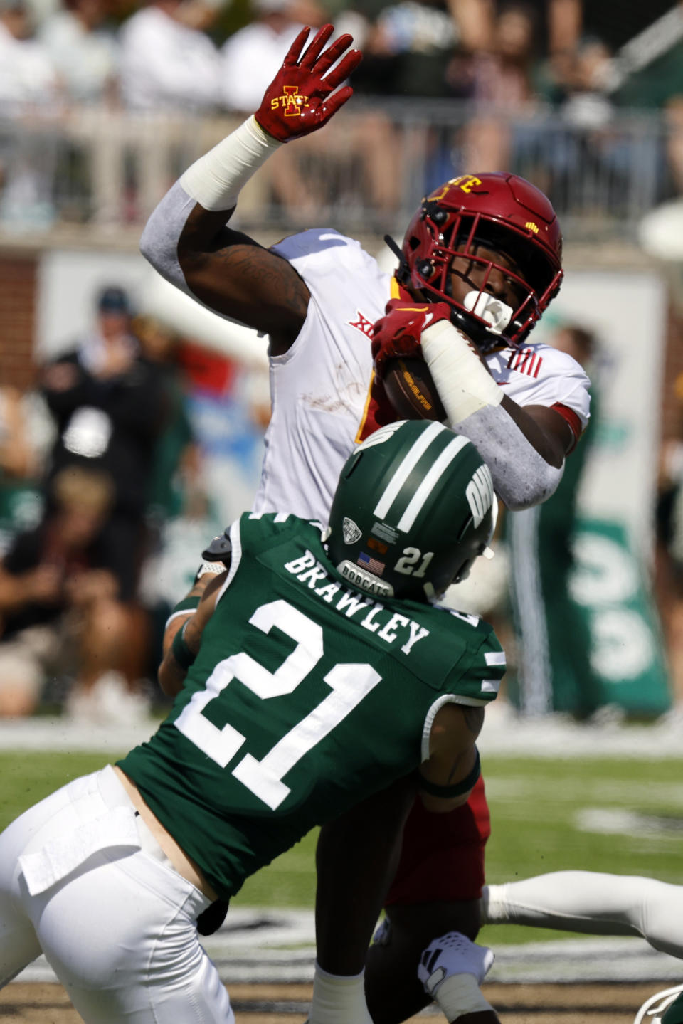 Iowa State running back Cartevious Norton, right, is stopped by Ohio defensive back Austin Brawley during an NCAA college football game Saturday, Sept. 16, 2023 in Athens, Ohio. (AP Photo/Paul Vernon)