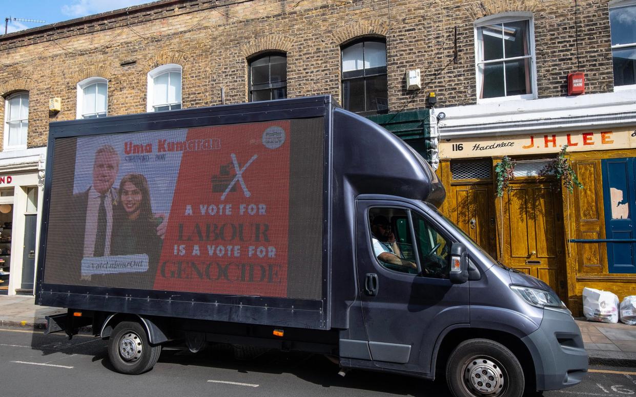 A pro-Palestine mobile billboard outside a polling station in Bethnal Green, east London