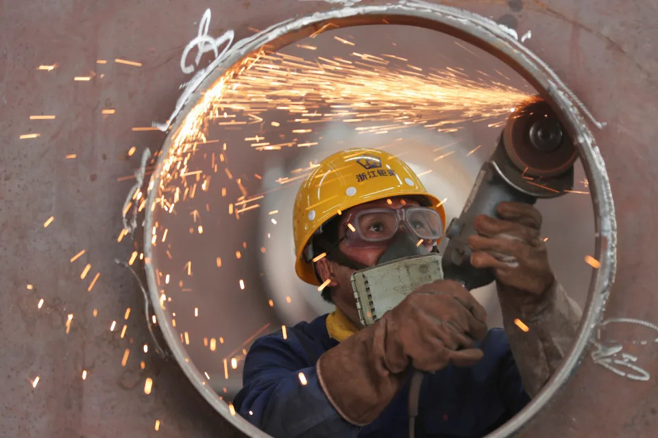 An employee works on a production line manufacturing steel structures at a factory in Huzhou, Zhejiang province, China May 17, 2020. Picture taken May 17, 2020. China Daily via REUTERS  ATTENTION EDITORS - THIS IMAGE WAS PROVIDED BY A THIRD PARTY. CHINA OUT.