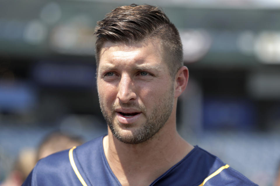 Tim Tebow talks to reporters during a news conference prior to the Eastern League All-Star minor league baseball game, Wednesday, July 11, 2018, in Trenton, N.J. (AP Photo/Julio Cortez)