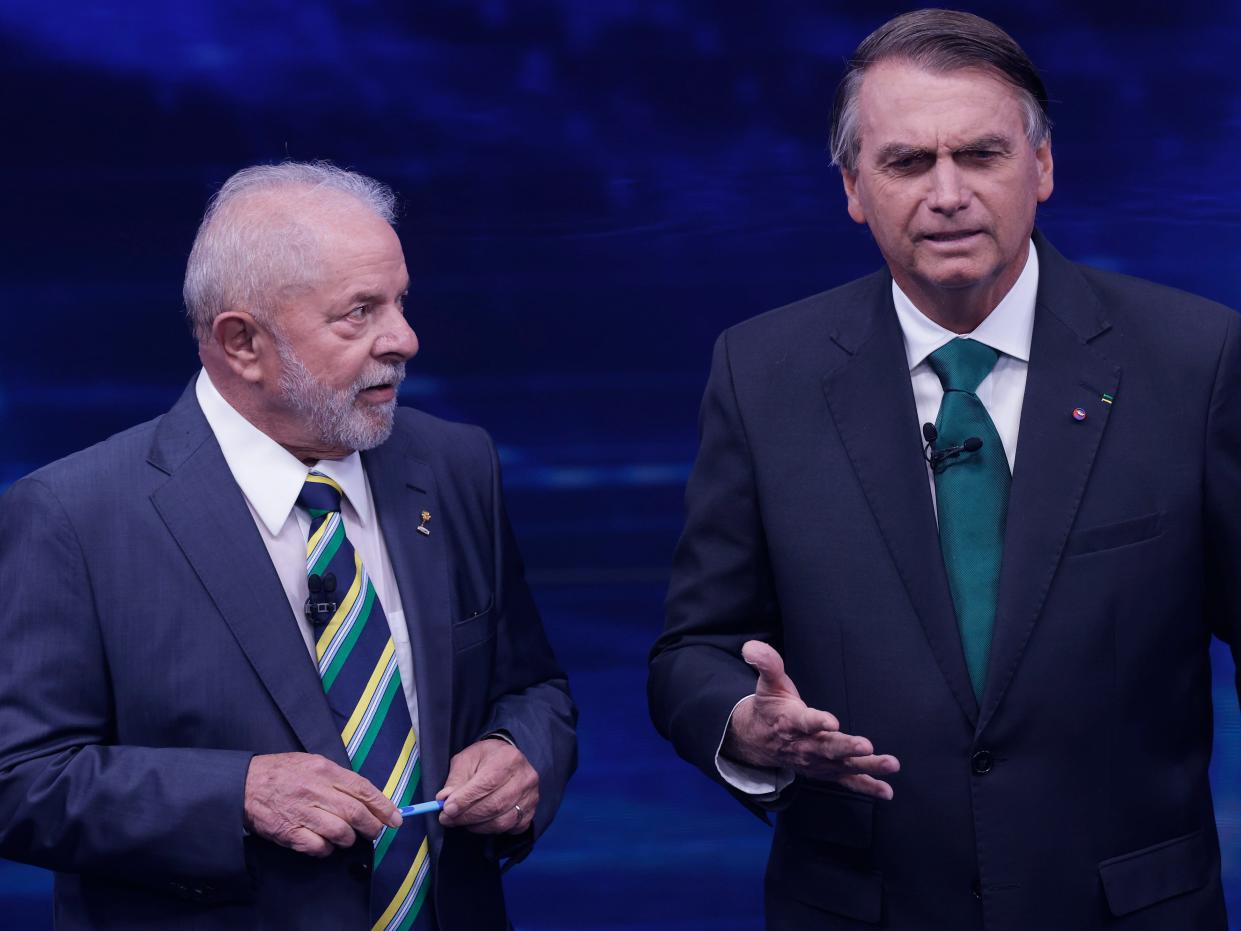 Luiz Inácio Lula Da Silva and Jair Bolsonaro speak to each other during the presidential debate ahead of the run-off on October 16, 2022 in Sao Paulo, Brazil.