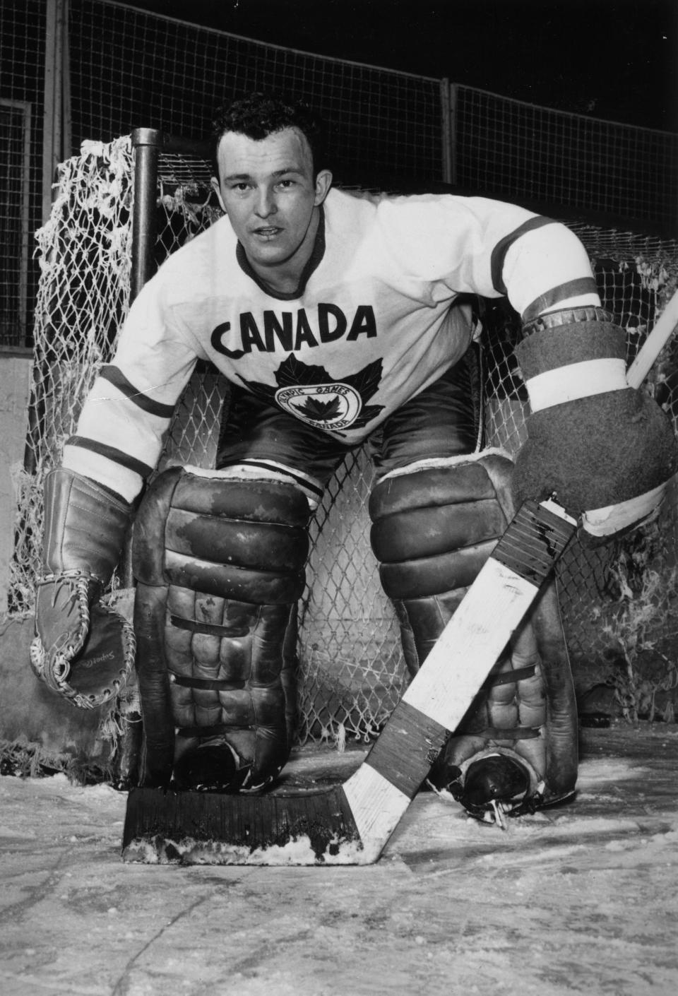 26th January 1956:  Denis Brodeur, the first line goalkeeper of Canada's ice hockey team during a practice match. The team are in training to defend their title against Russia in the Winter Olympics at Cortina D'Ampezzo, Italy.  (Photo by Fox Photos/Getty Images)