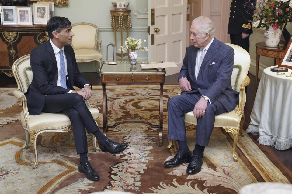 King Charles III, and Britain's Prime Minister Rishi Sunak talk during their meeting at Buckingham Palace, London, Wednesday, Feb. 21, 2024. (Jonathan Brady/Pool Photo via AP)