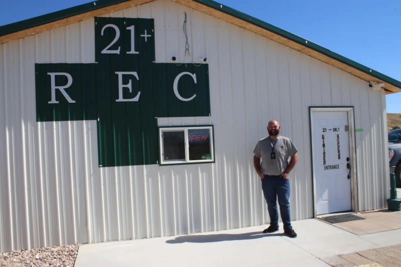 Lando Blakley stands outside his retail marijuana store, Dino Dispensary, in Dinosaur, Colo. Photo by Markian Hawryluk/KFF Health News