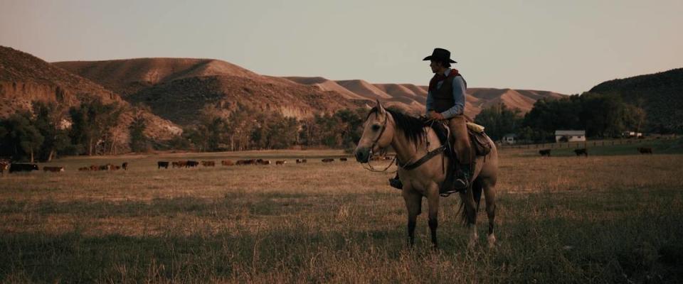 Actor Jay Pickett sits on a horse in a field of cattle in this footage from his film “Treasure Valley.” Pickett, who wrote and starred in the movie, died on set unexpectedly.